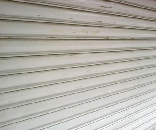 解構(gòu)造大港區(qū)保溫卷簾門維修難題 廠家直銷與天津建材全解讀